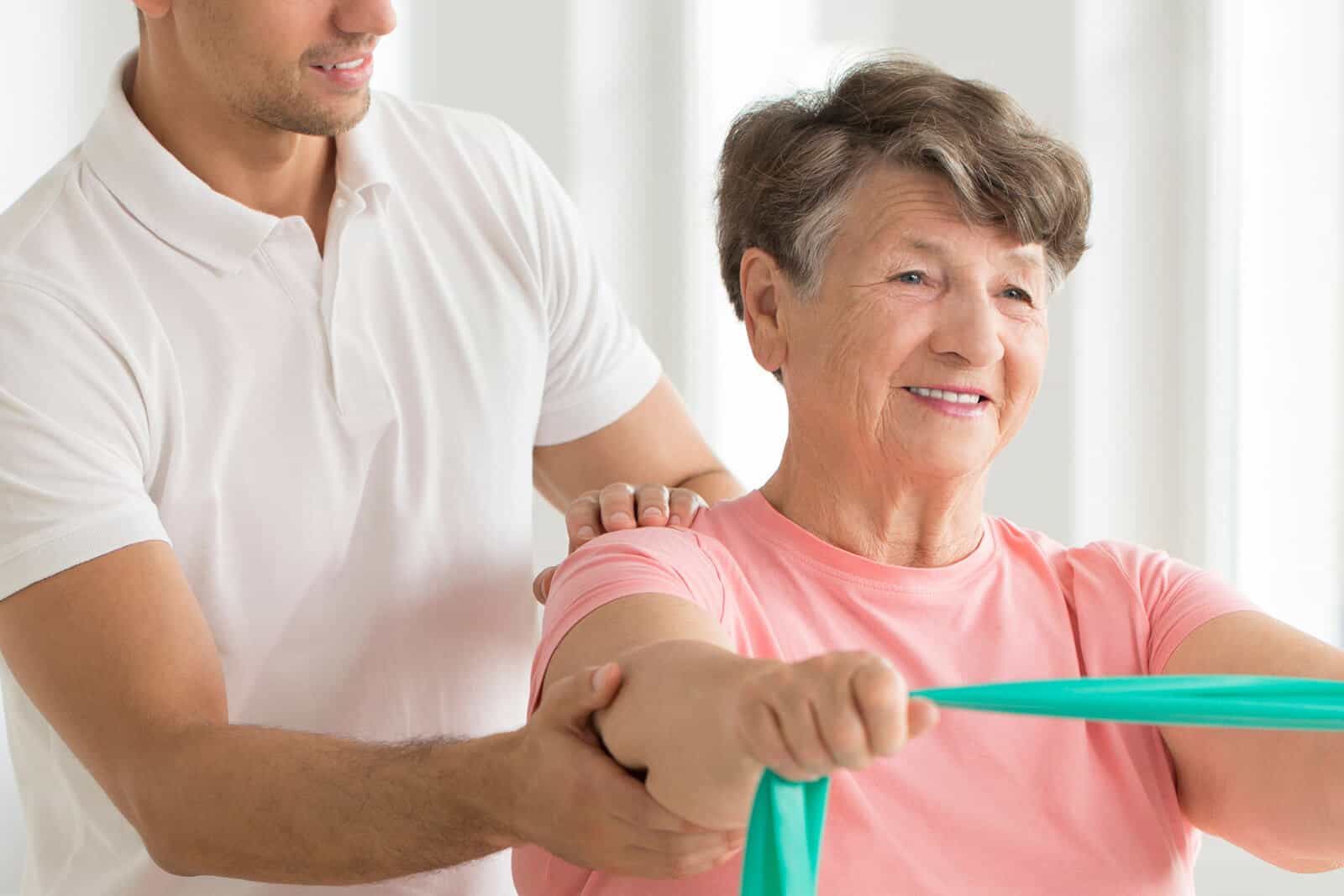 Senior woman receiving physiotherapy treatment